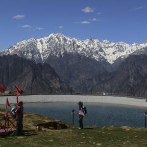 Artificial lake at Auli with Bharmal peak dominating the skyline.