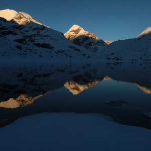 After a round of snowfall, Vasuki Tal looks very different. Sri Kailas peak glowing in the sunlight at dawn. 