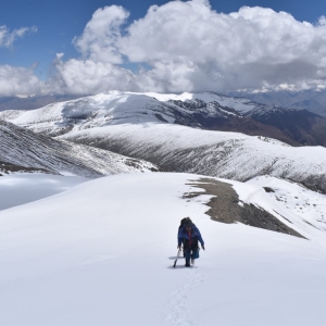 Climbing with an aerial view of Kongmaru La Ridge and Indus valley behind